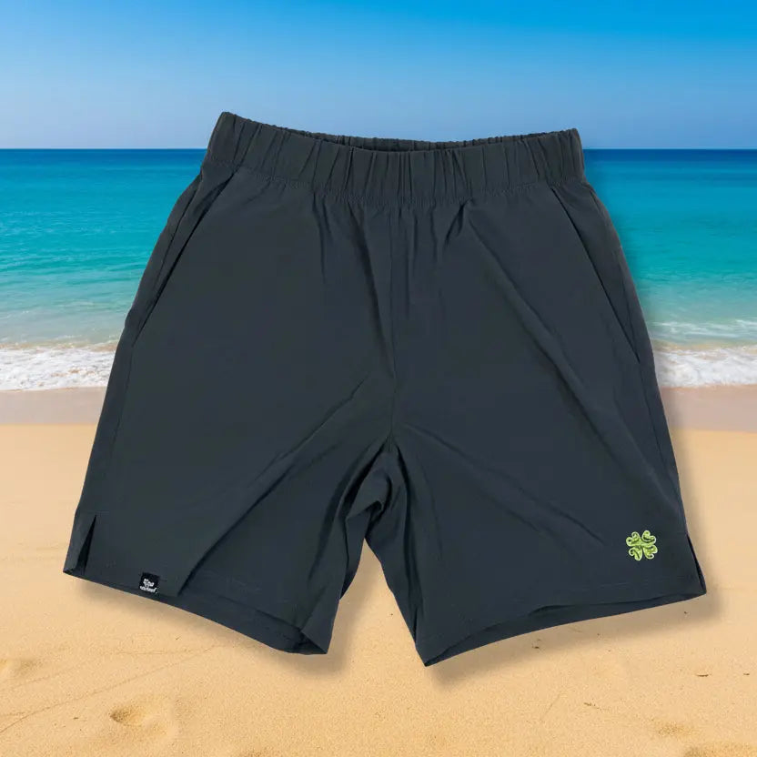 Dark gray shorts with a green logo on a light gray background