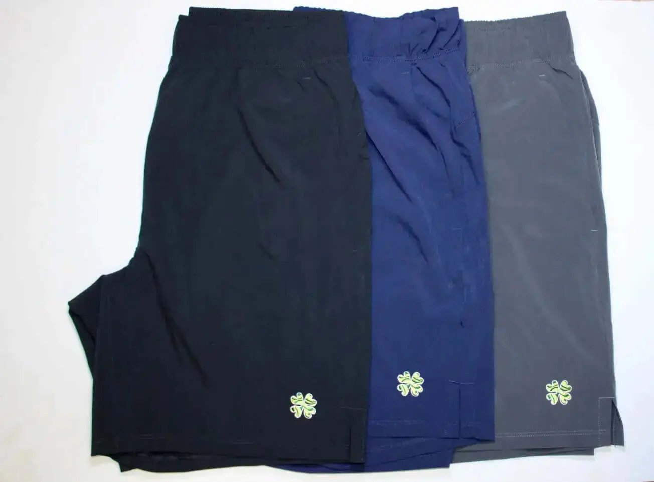 mens athletic shorts in black blue and gray with clover logo lazy tuesdays