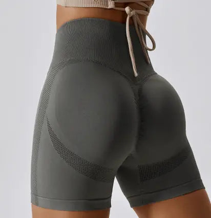 woman in dark gray yoga shorts